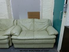 A leather suite comprising three seat sofa, two seat sofa,
