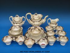 A complete 19thC Rockingham tea service with hand-decorated scenes of ruins.
