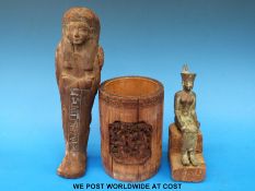 An Egyptian bronze seated figure of the god Neith on wooden plinth together with a carved wooden