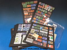A quantity of Mint GB stamps on 12 Hagner sheets including blocks control numbers,