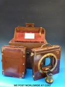 A leather-cased W Watson mahogany and gilt plate camera with two lenses
