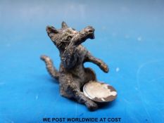 An Austrian cold painted figure of a cat with bowl (height 3cm)