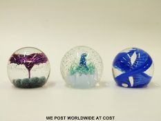 Three Caithness glass paperweights: Jacob's Ladder, Cination and Fountain all etched to bases,