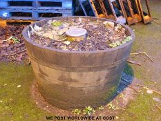 A coopered half barrel planter