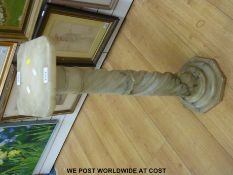 A 19thC wrythen moulded marble plinth raised on an octagonal base (height 79cm)