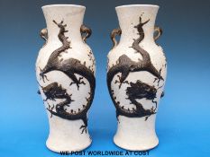 A pair of 19thC Chinese porcelain crackle vases with raised dragon decoration (25cm tall)
