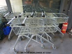 Six shopping trolleys and some baskets