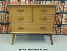A retro 1960s/70s chest of four short drawers over one long raised on tapering splayed feet (W96cm