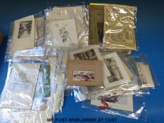A quantity of early 20thC greetings cards including humorous, early 20thC photographs of ladies,