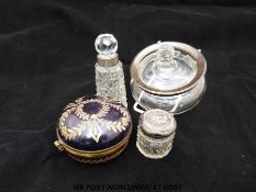 An enamelled brass mounted hinged trinket dish, silver mounted bottles and an unmarked example.