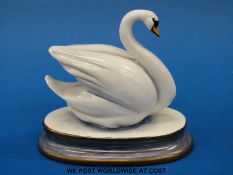 A Michael Sutty figure of a swan,