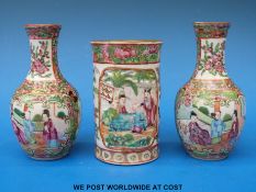A pair of Chinese Canton famille rose vases (12cm tall) together with another of cylindrical form.