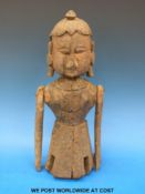 An Indian Rajasthan carved wooden figure with articulated limbs (38cm tall)