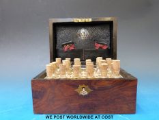 A portable mahogany homeopathic medicine box with brass escutcheon,