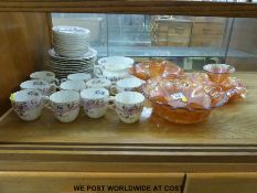 A small collection of carnival glass together with an early twentieth century tea service