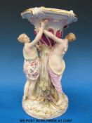 A 19thC Miessen figure comport decorated with three ladies supporting upper section (25cm tall)