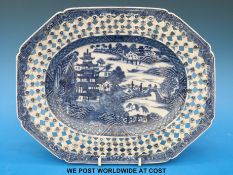 An 18thC Chinese blue and white reticulated platter with relief moulded flowers and pagoda and