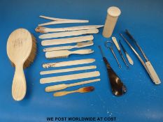 An ivory backed brush, ivory needle case,