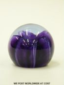 Seven Caithness glass paperweights, two Reflections, two Mooncrystal, Pebble, SeaGems and Wisi,