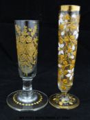 Two Moser enamelled and gilt bud vases, 11.5 and 10cm tall.