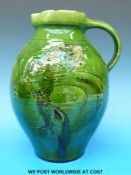 A Devon jug by Brannam with fish design with impressed Liberty mark to base height 27cm