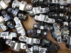 A box of SLR cameras including Pentax,
