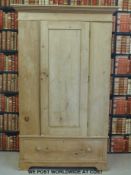 A pine single drawer wardrobe with drawer below (W131 x D56 x H213cm)