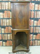 An oak double height corner cupboard (height 183cm)