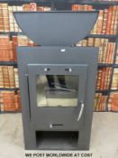 A modern unused Caminos wood burning stove,