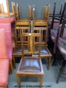 Eleven oak dining chairs with drop in upholstered seats