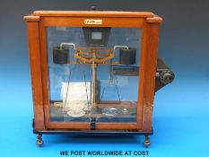 An Oertling mahogany cased laboratory balance