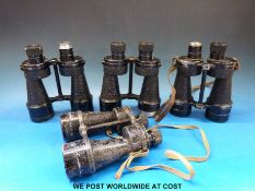 A box of binoculars some with military marking