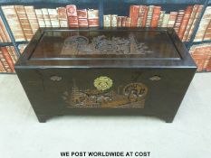 An Oriental blanket chest with carved decoration (W93cm D45cm H50cm)