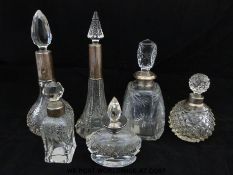 Six cut glass scent bottles with silver collars together with five further cut glass scent bottles