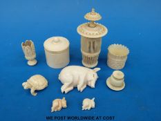 A quantity of ivory items to include fine pierced screw top pot,