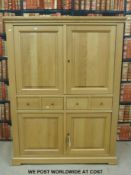 A modern light oak cupboard with two drawers and four doors (W131 x D50 x H172cm)