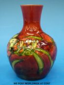 An early Moorcroft flambe vase decorated with Spring flowers(12.