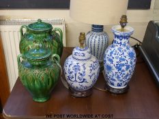 Two green glazed lidded jars and three lamps
