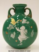 A 19thC Bohemian glass moon flask with enamelled decoration of a putti with playing card and a