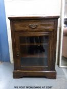 A small oak glazed music cabinet with single drawer together with an Art Nouveau side table