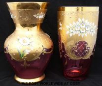 Two gilt and enamelled cranberry glass vases with applied flower decoration,