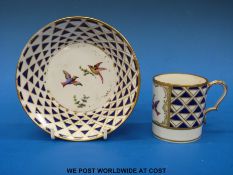 A Sevres style 19thC cup and saucer decorated with exotic birds,