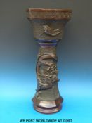 A Japanese bronze jardiniere stand with dragon and bird decoration in relief (height 67cm)