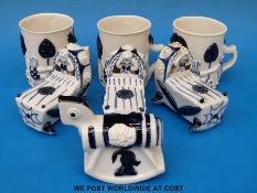 Seven Wilfred Gibson blue and white ceramic items, three mugs,