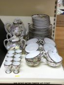 A collection of Japanese eggshell porcelain tea and dinnerware decorated with Peregrine Falcons /