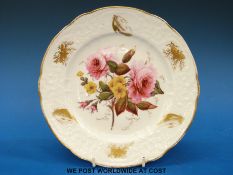 A hand painted cabinet plate possibly Coalport decorated with flowers and gilt painted moths and