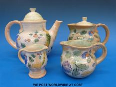 Royal Doulton tea pot, water pot, milk and cream jugs, all designed by F.