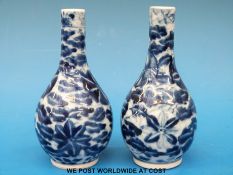 A pair of small 19thC Chinese blue and white vases (13cm tall)