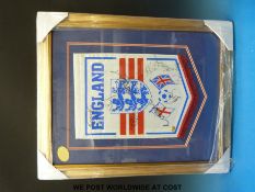 An England football pendant signed by nine players including Gary Neville, Paul Scholes, Nicky Butt,