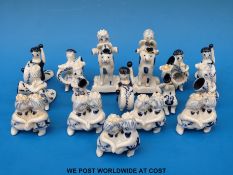 Sixteen Wilfred Gibson blue and white ceramic figures all playing musical instruments or dancing